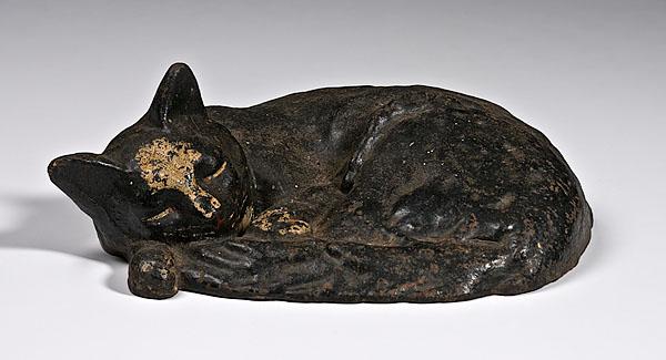 Appraisal: LARGE BLACK SLEEPING CAT DOORSTOP American ca s by either