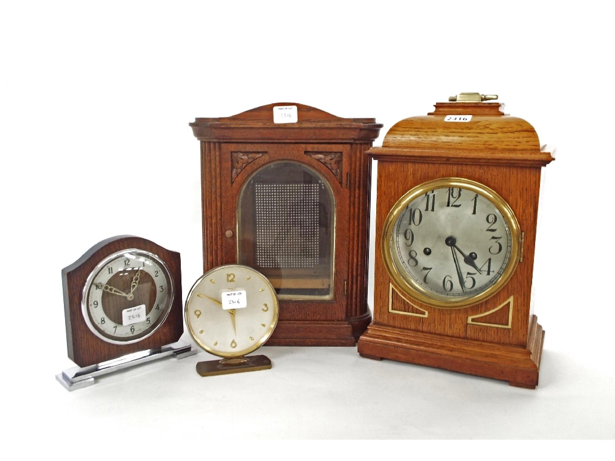 Appraisal: Oak two train mantel clock striking on a gong the