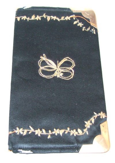 Appraisal: A ct gold mounted black silk rectangular wallet decorated with