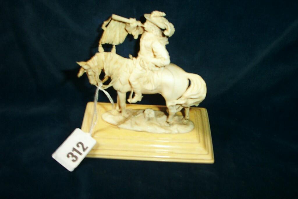 Appraisal: A th century carved ivory figure of a cavalier on