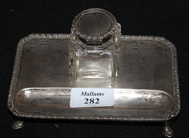 Appraisal: A SILVER INKSTAND of plain rectangular form with gadroon border