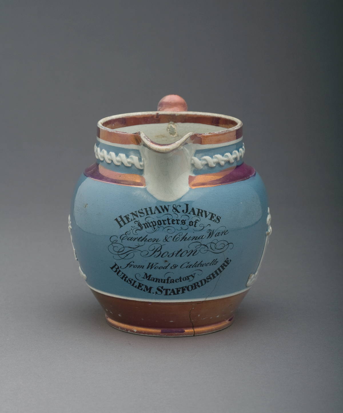 Appraisal: WOOD CALDWELL PEARLWARE PINK LUSTRE-DECORATED BLUE-GLAZED ADVERTISING JUG CIRCA -