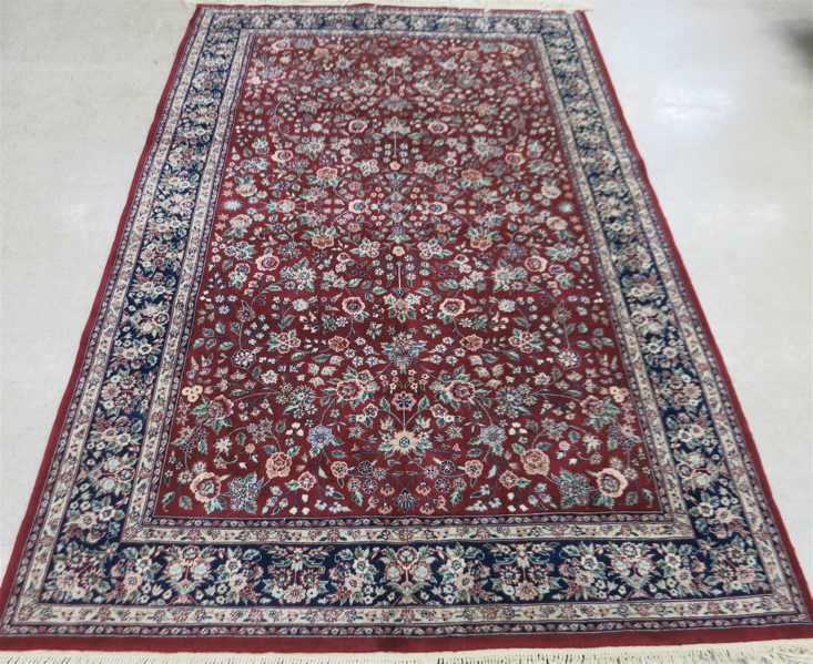 Appraisal: HAND KNOTTED ORIENTAL CARPET Sino-Persian featuring a rectangular floral decorated