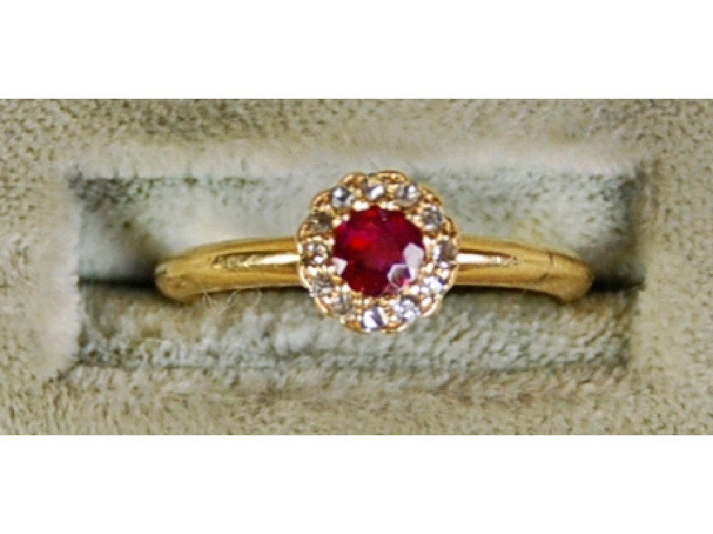 Appraisal: VICTORIAN ct GOLD RUBY AND DIAMOND CIRCULAR CLUSTER RING set