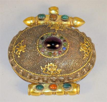 Appraisal: Sino-Tibetan gilt-metal jeweled locket large oval locket intricately decorated with