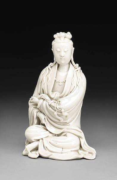 Appraisal: A Dehua porcelain seated figure of Guanyin th Century Carefully