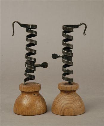 Appraisal: Pair of English Wrought-Iron Spiral Ejector Candlesticks in in diam