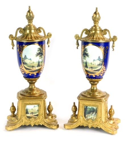 Appraisal: A pair of Continental urn clock garnitures each with acorn