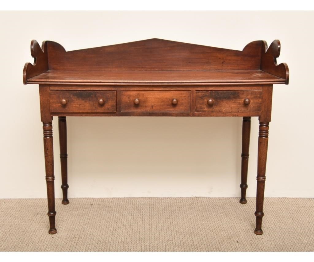 Appraisal: Irish Sheraton mahogany serving table c with galleried top above