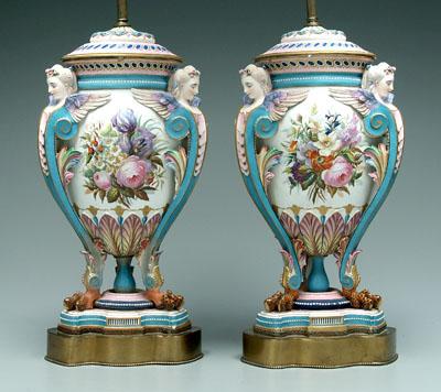 Appraisal: Pair bisque lamps hand painted scenes flanked by winged female