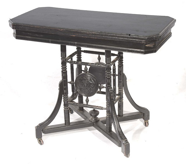 Appraisal: AN AESTHETIC EBONISED CARD TABLE in the style of E