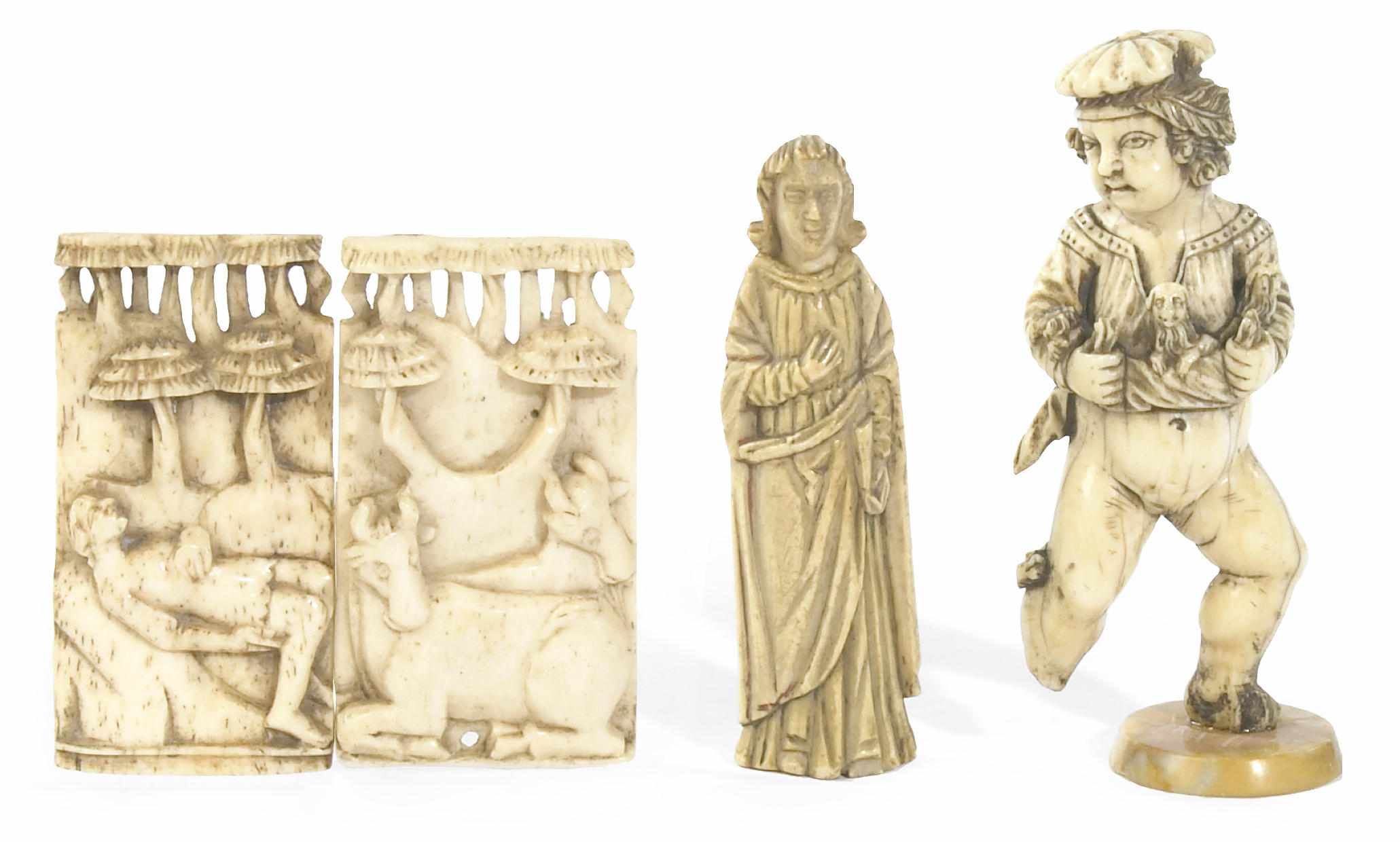 Appraisal: Two small carved ivory figures together with a pair of