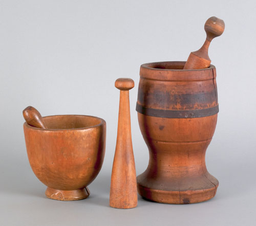 Appraisal: Two turned wood mortar and pestles th c tallest -