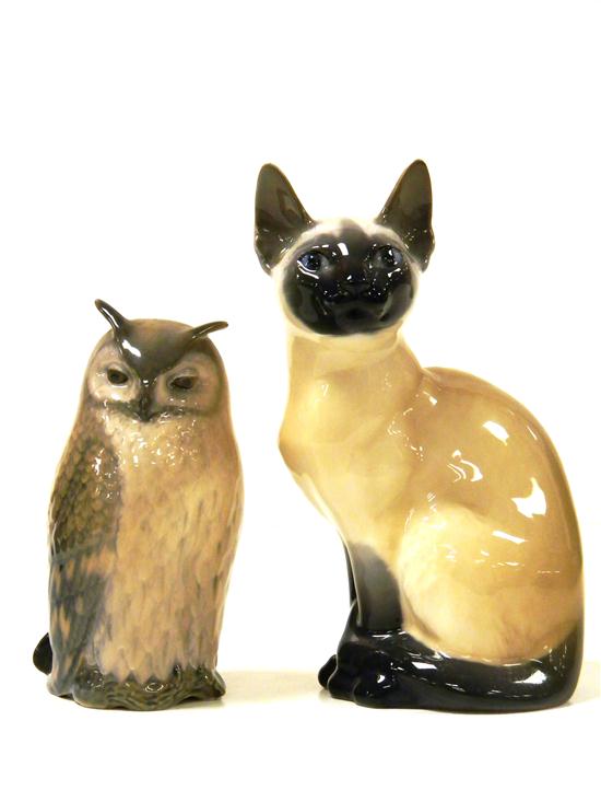 Appraisal: Two Royal Copenhagen porcelain figurines th C one a Siamese