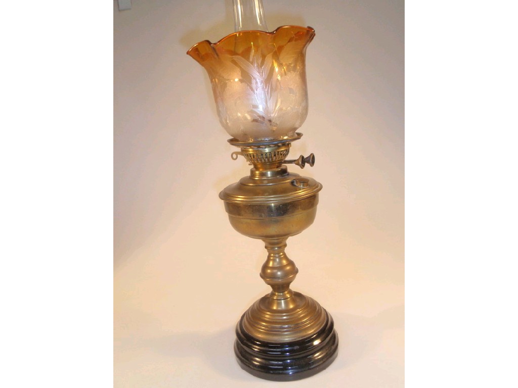 Appraisal: A Victorian brass oil lamp with double burner