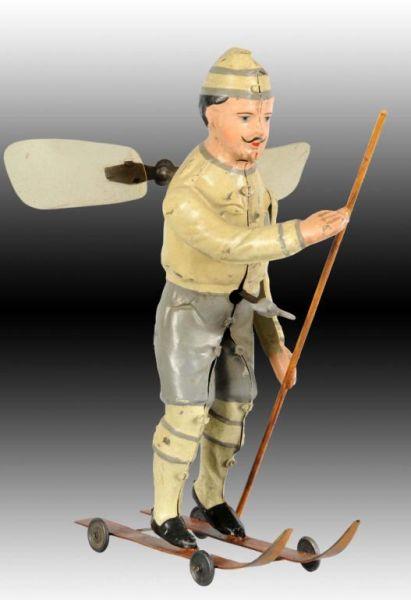 Appraisal: German Tin Wind-Up Hand-Painted Skiing Toy Description When wound propellers