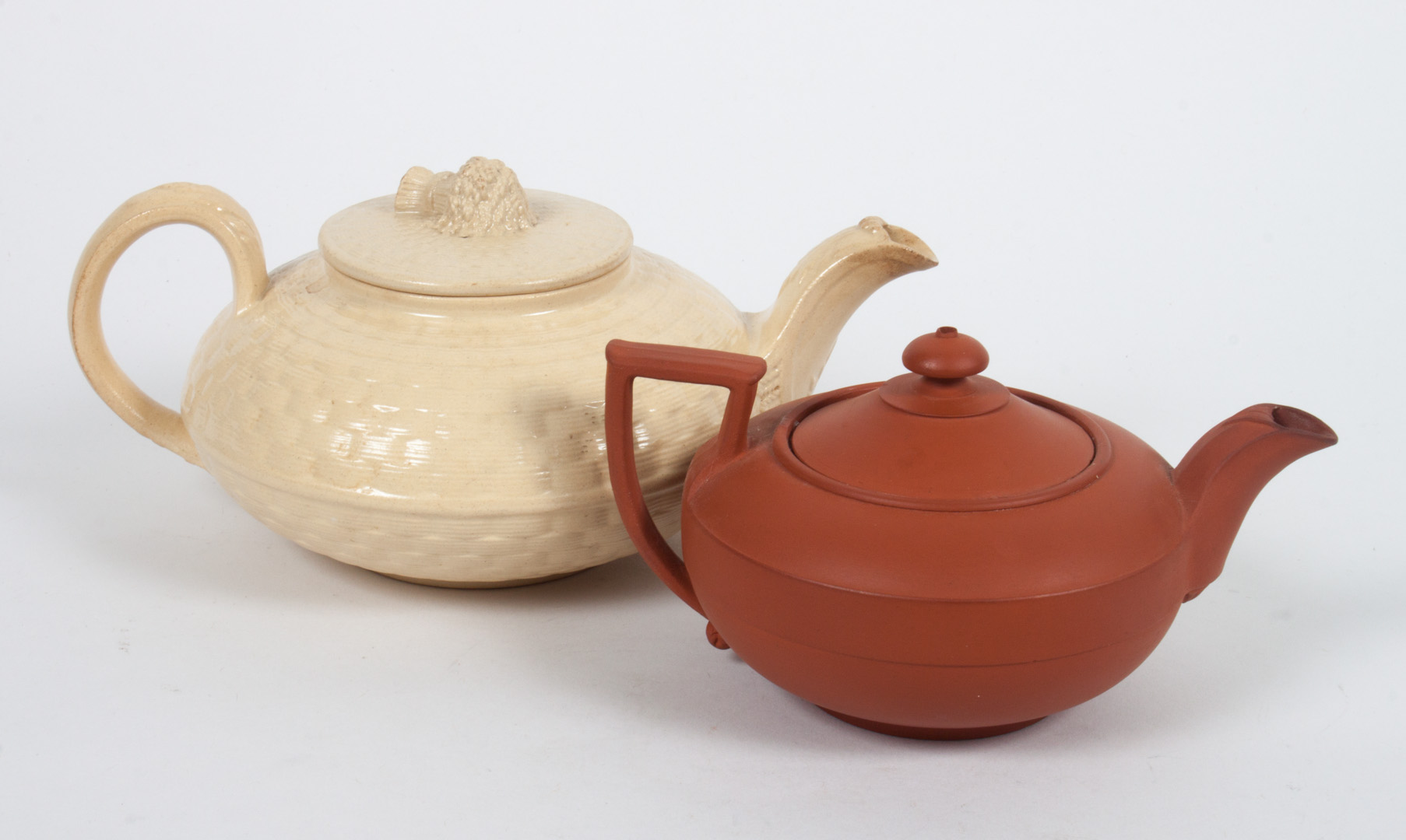 Appraisal: Wedgwood cane ware and redware teapots late th early th