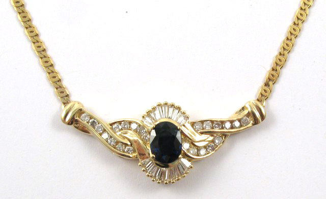 Appraisal: SAPPHIRE DIAMOND AND YELLOW GOLD NECKLACE set with an oval-cut