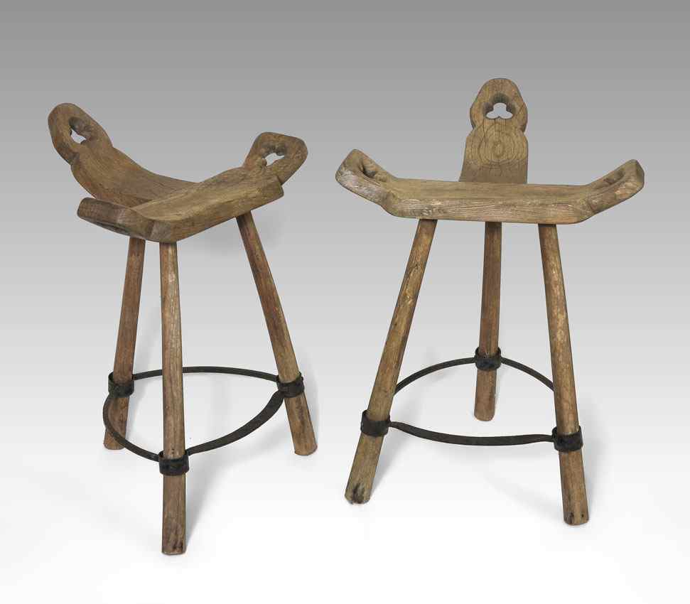 Appraisal: PAIR OF EARLY SPANISH STOOLS Carved and shaped seat on