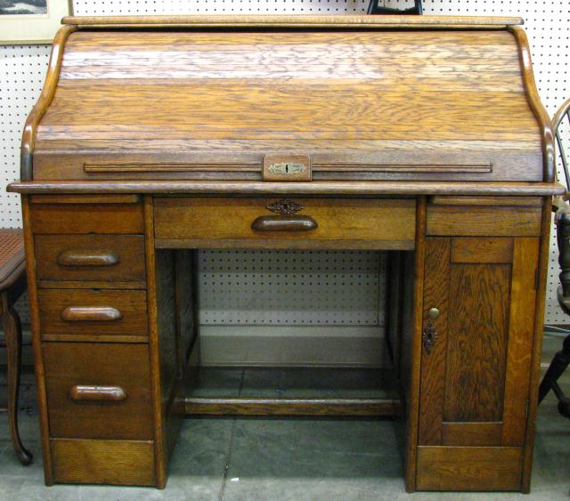 Appraisal: Antique Oak S Rolltop Desk wide cubby hole interior drawers