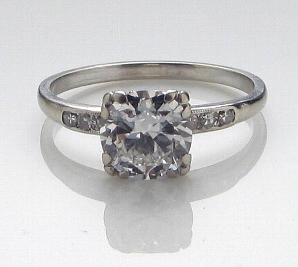 Appraisal: A diamond ring centering a transitional-cut diamond principal diamond weighing