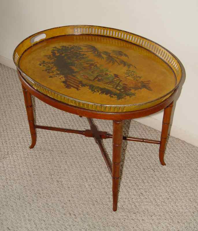 Appraisal: DECORATED TOLE WARE TRAY ON STAND Scene of children playing