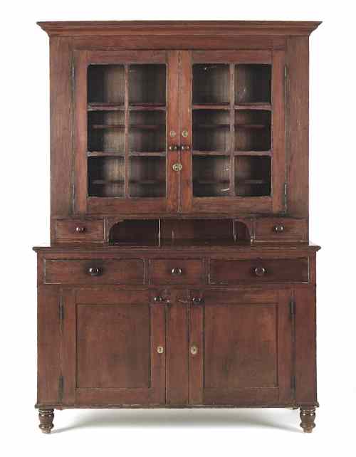 Appraisal: Pennsylvania two-piece walnut Dutch cupboard ca the upper section with