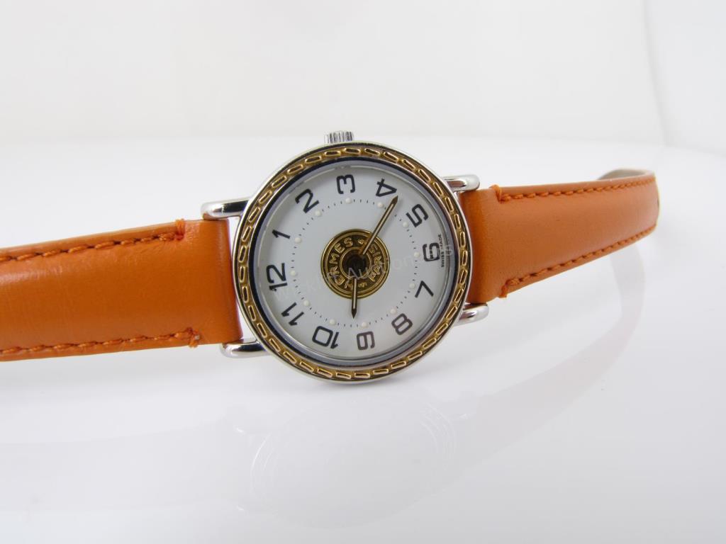 Appraisal: A lady's Hermes wristwatch with white dial black Arabic numerals