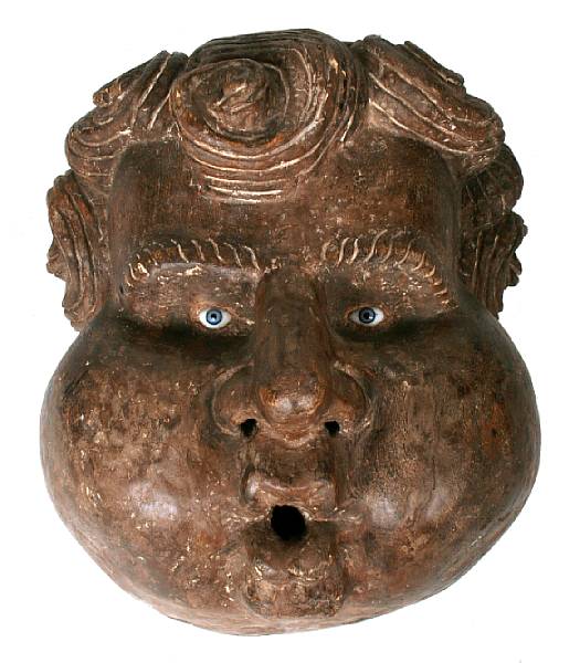 Appraisal: A large carved wood mask of a man with glass