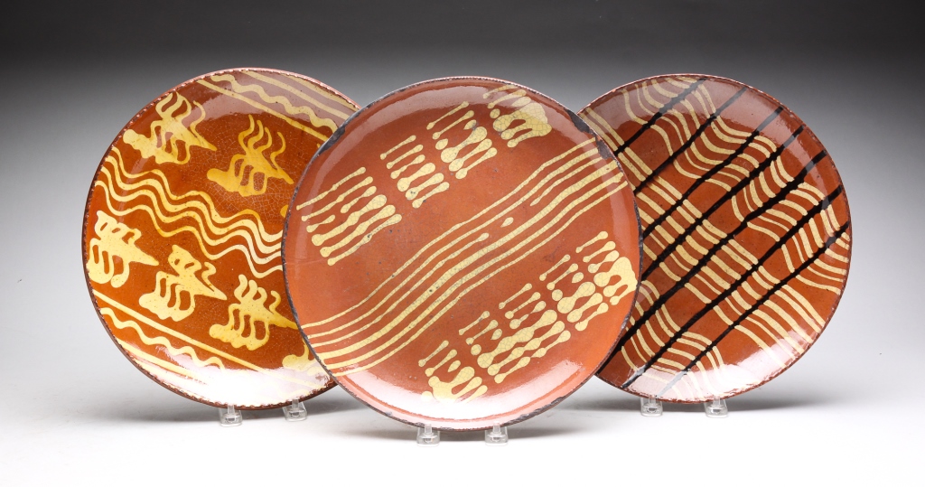 Appraisal: CONTEMPORARY TURTLE CREEK REDWARE CHARGERS Ohio Slip decorated Pieces all