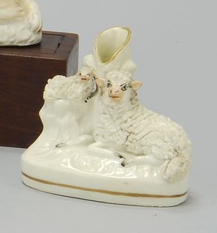 Appraisal: STAFFORDSHIRE FIGURAL SPILL Circa In the form of a recumbent