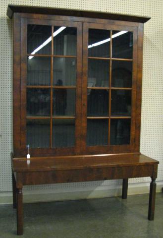 Appraisal: Antique Stepback bookcase with storage table base double glass door