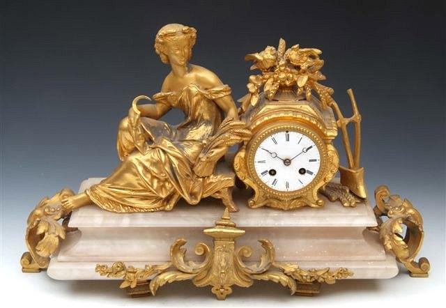 Appraisal: A late th Century mantel clock with gilt scrolls and