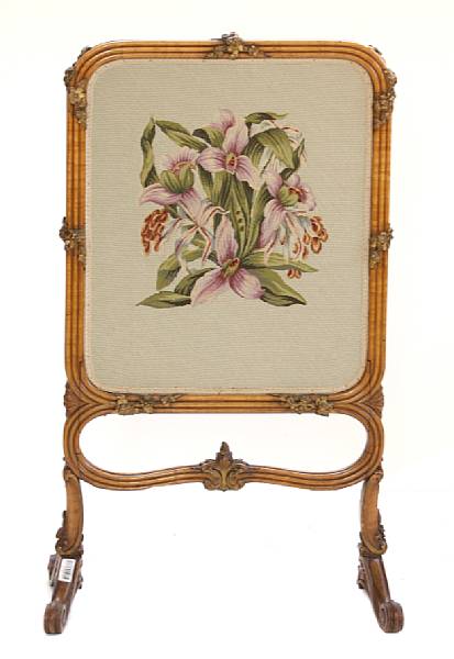 Appraisal: A Rococo style bird's eye maple and needlepoint firescreen height