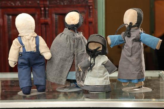 Appraisal: FOUR AMISH MADE CLOTH DOLLS A boy with blue socks