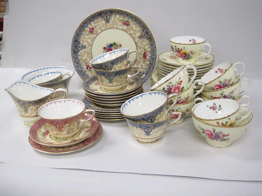 Appraisal: A Coalport part Tea Set floral reserves puce ground with