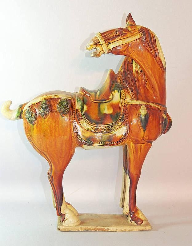 Appraisal: Tang-style Pottery Horse Tang-style pottery horse with sancai glaze The