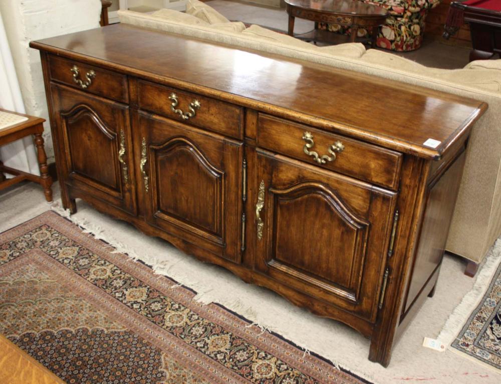 Appraisal: PROVINCIAL STYLE WALNUT BUFFET French th century having three lined