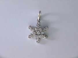 Appraisal: A platinum diamond set snowflake charm by Tiffany Co estimated