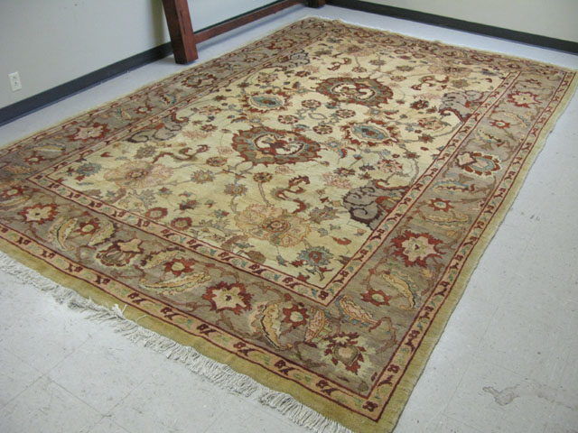 Appraisal: AFGHANI PERSIAN CARPET double medallion and overall floral decorated khaki