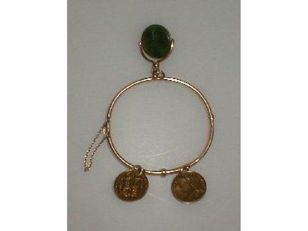 Appraisal: A Victorian plain hinged bangle marked with jade shamrock engraved