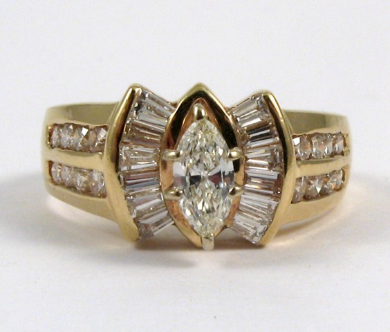 Appraisal: DIAMOND AND FOURTEEN KARAT GOLD RING centering a marquise-cut diamond