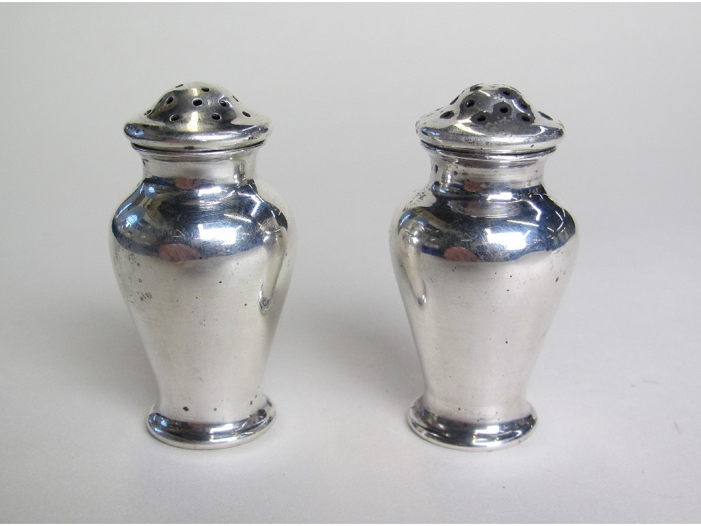 Appraisal: Pair of George V silver baluster shaped salt and pepper