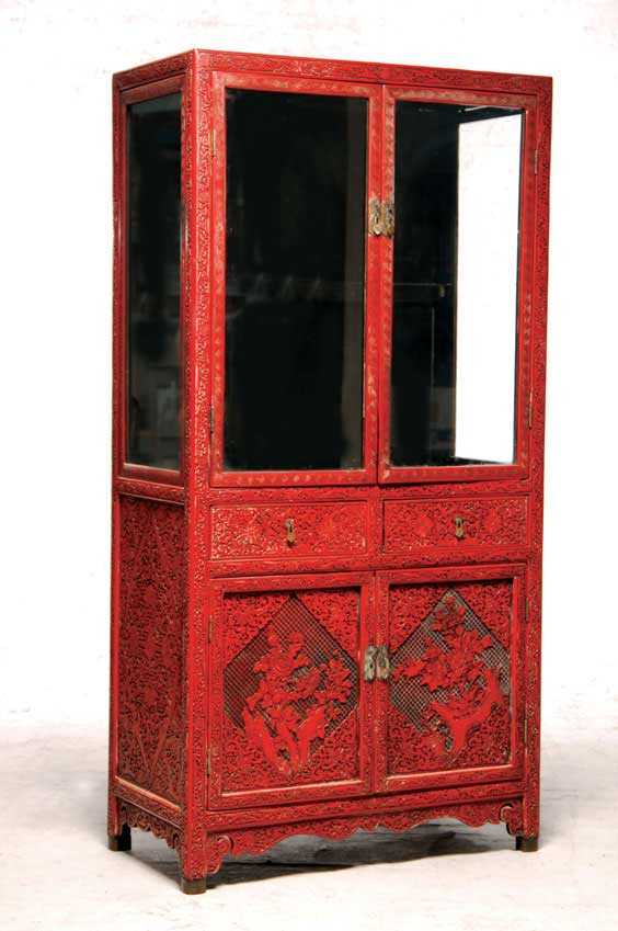 Appraisal: CHINESE LACQUER CURIO CABINET Chinese carved cinnabar lacquer curio cabinet