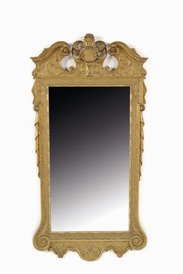 Appraisal: A carved giltwood wall mirror in George I style with