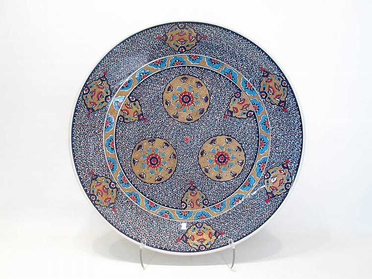 Appraisal: TURKISH IZNIK POTTERY CHARGER hand painted with enamels golden filled