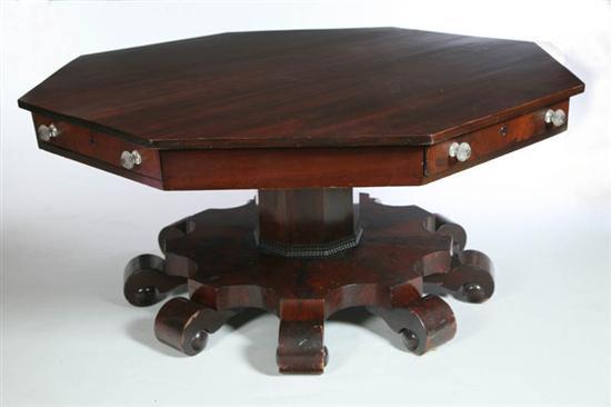 Appraisal: EMPIRE OCTAGONAL CENTER TABLE American th century mahogany with figured