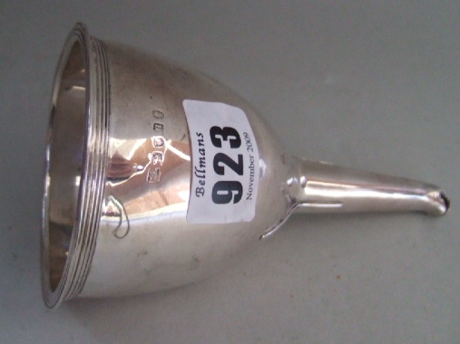 Appraisal: A silver wine funnel with reeded decoration to the rims