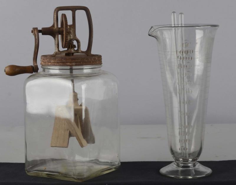 Appraisal: Lot of Glass Beaker and Butter Churn Two glassware items