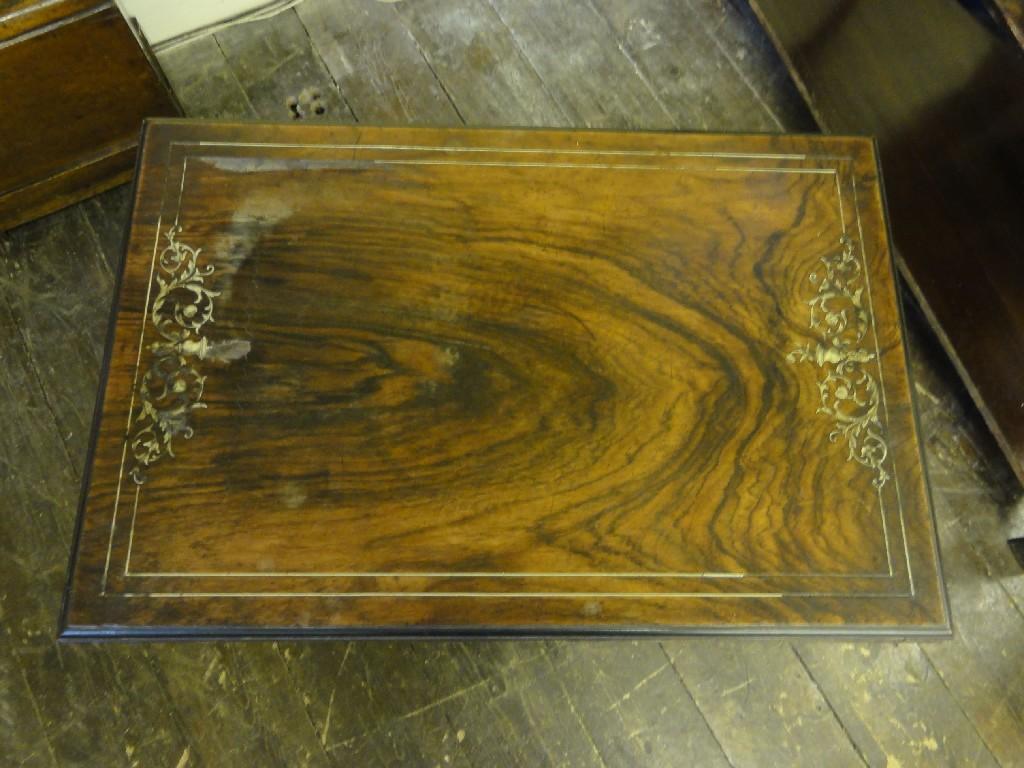 Appraisal: A late th century rosewood foldover top card table of